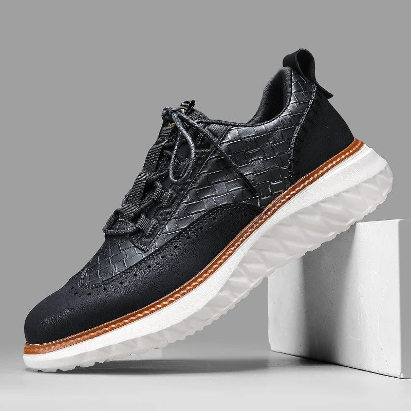 Men's white textured brogue sneakers with platform sole, lace-up closure, and geometric perforated detailing
