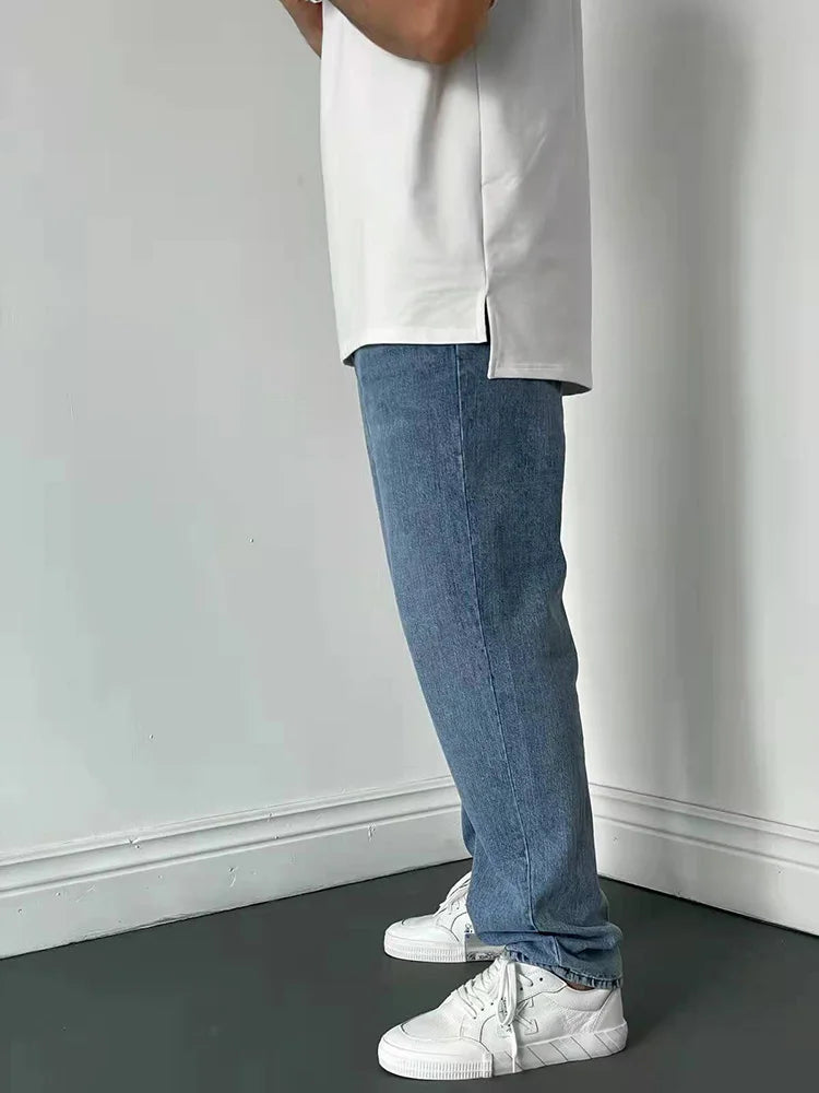 Men's classic loose straight-leg blue denim jeans with relaxed comfort fit and cotton blend fabric