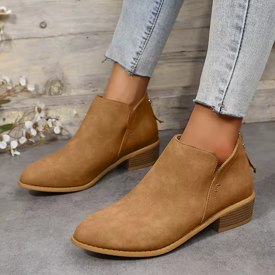 Women's black cushioned ankle boots with supportive interior and lightweight everyday comfort design