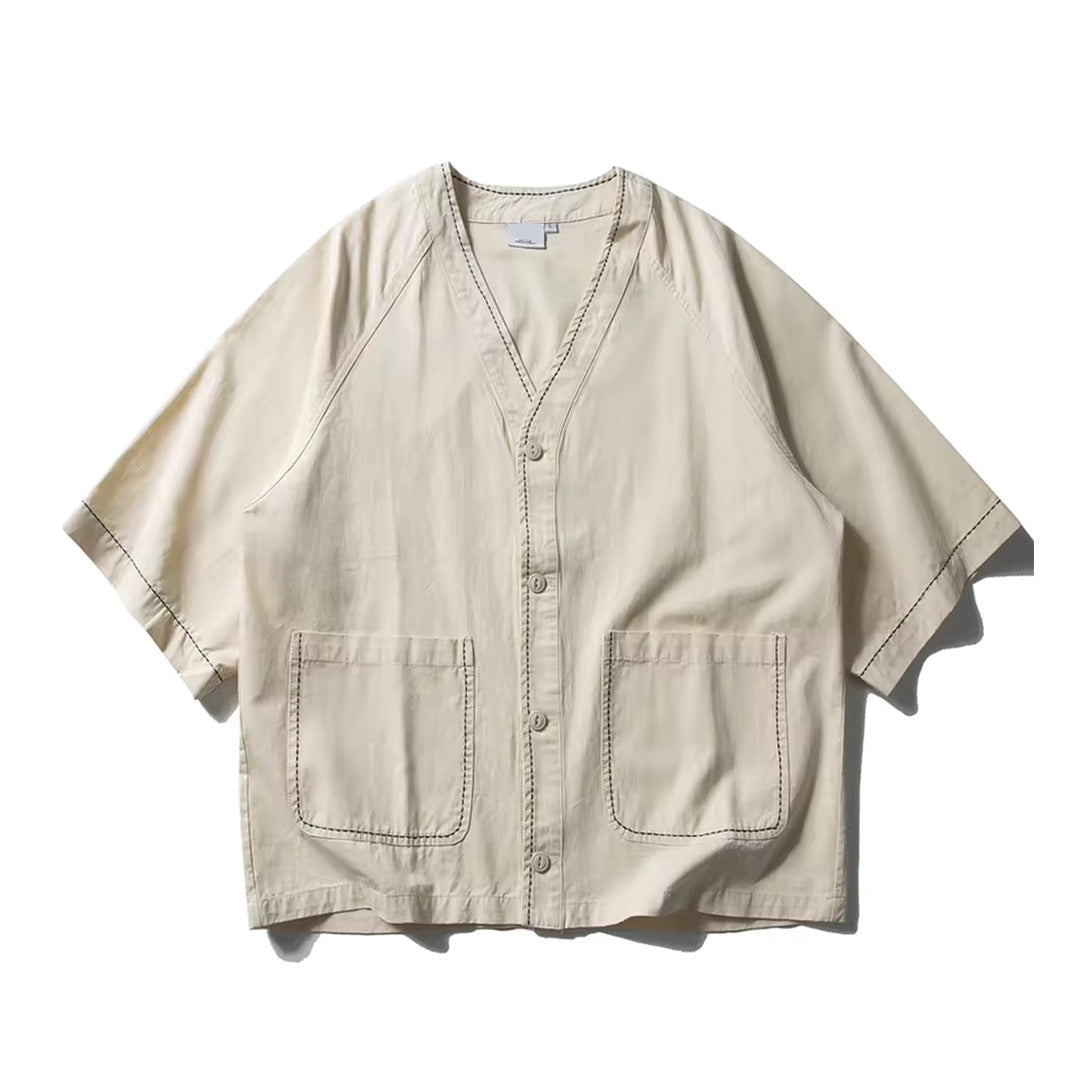 White cotton regular fit shirt deep V open collar oversized pockets contrast topstitching minimalist