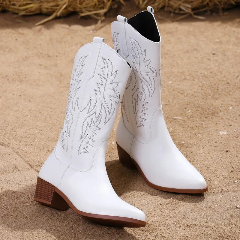Brown mid-calf western boots with pointed toe, block heel, and classic cowboy stitching details