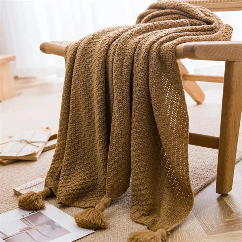 Cream handknit Nordic throw blanket with tassel fringe, ultra-soft cozy style for beds and couches