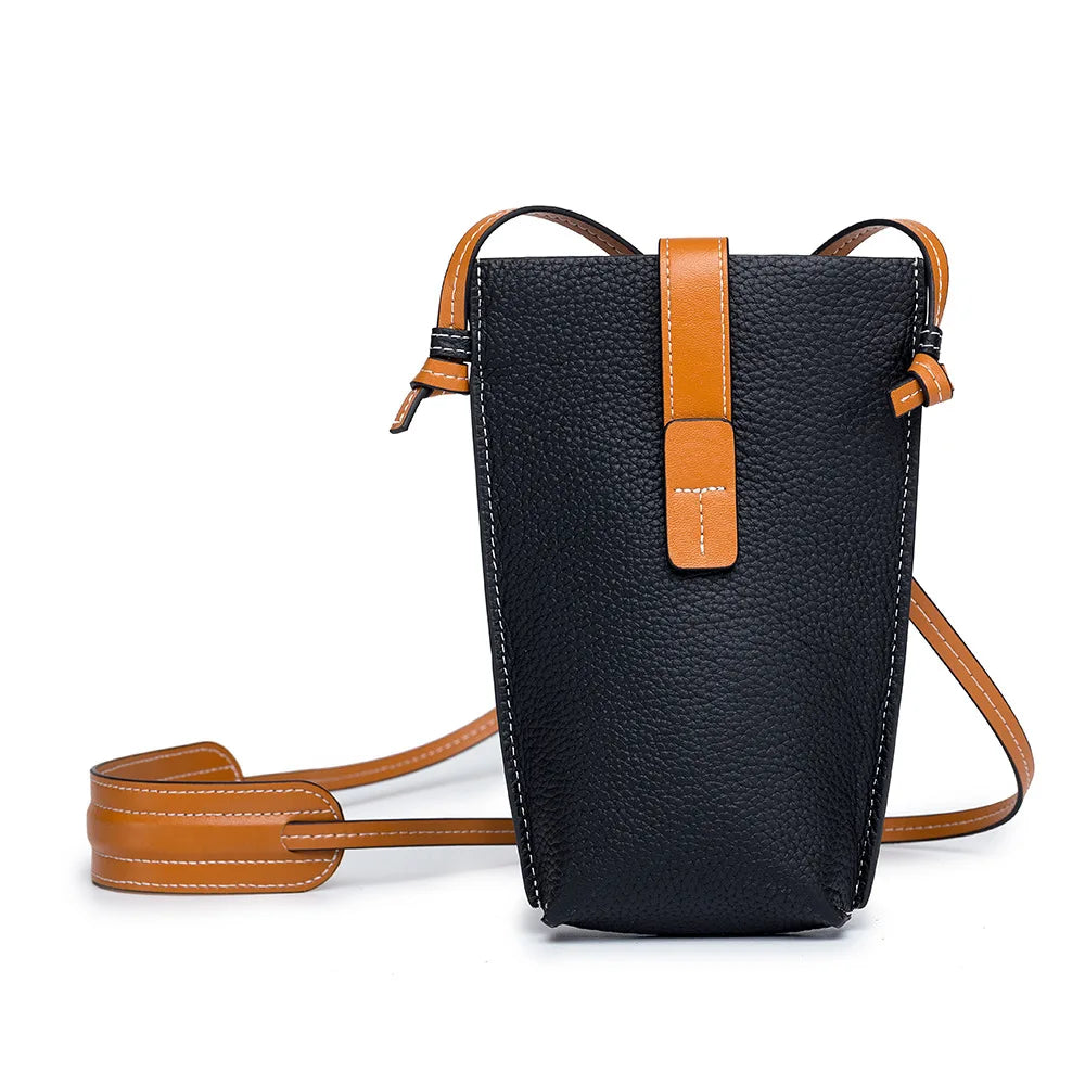 Women's compact vertical crossbody bag in vegan PU leather with adjustable strap for everyday wear