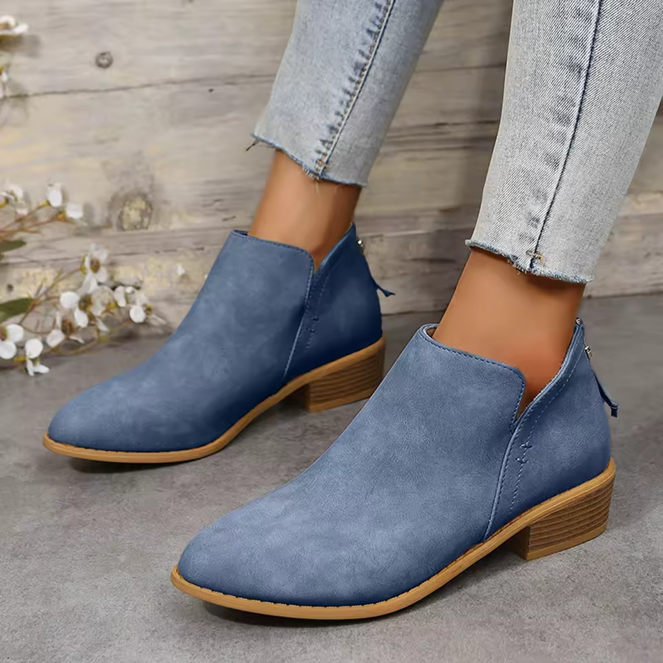 Women's black cushioned ankle boots with sleek silhouette and lightweight all-day comfort support