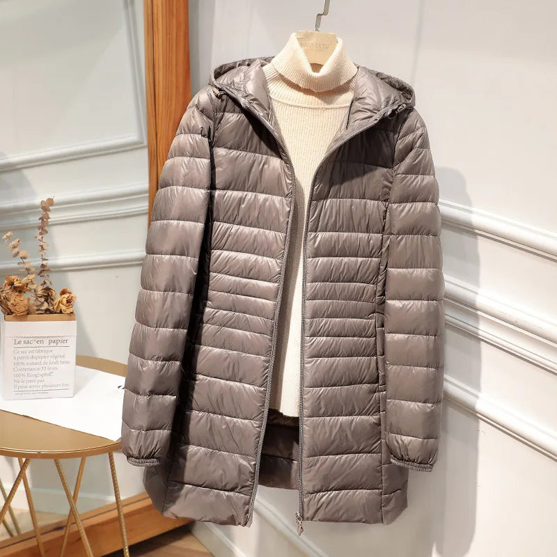 Women's long puffer jacket with hood, regular fit, elongated silhouette for cold-weather warmth