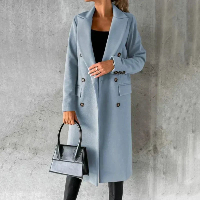 Beige double-breasted winter trench coat with structured silhouette and polished tailored fit