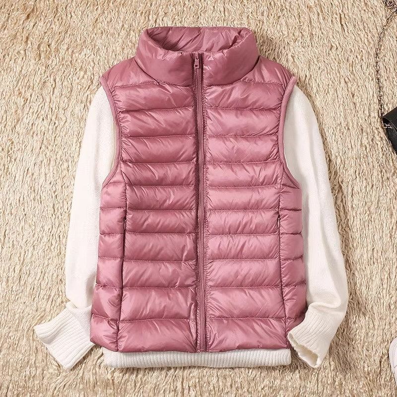 Women's cropped sleeveless down puffer vest lightweight nylon shell for layering outdoor adventures