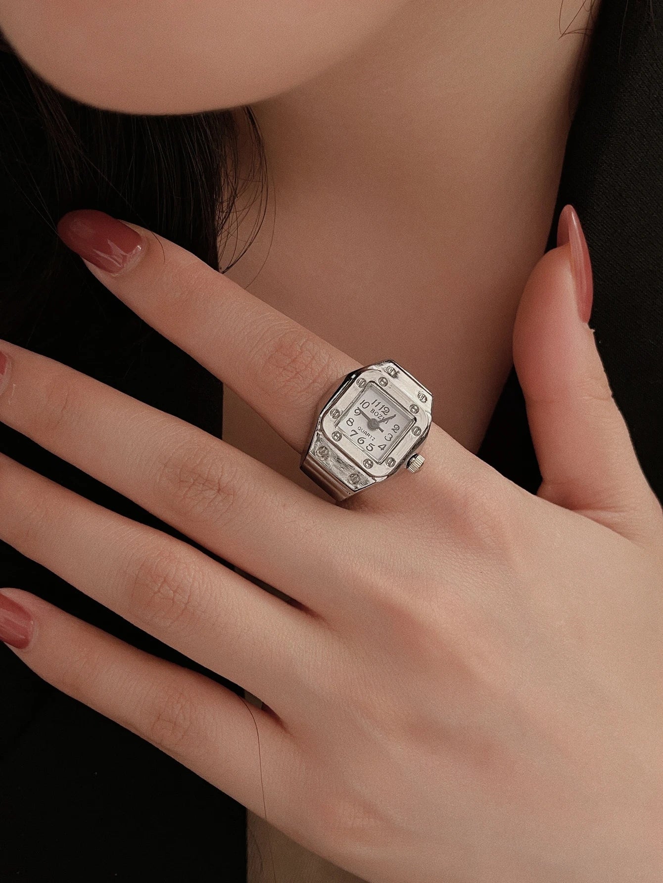 Women's ring watch gold-tone finger-worn timepiece with minimalist dial as statement jewelry accessory