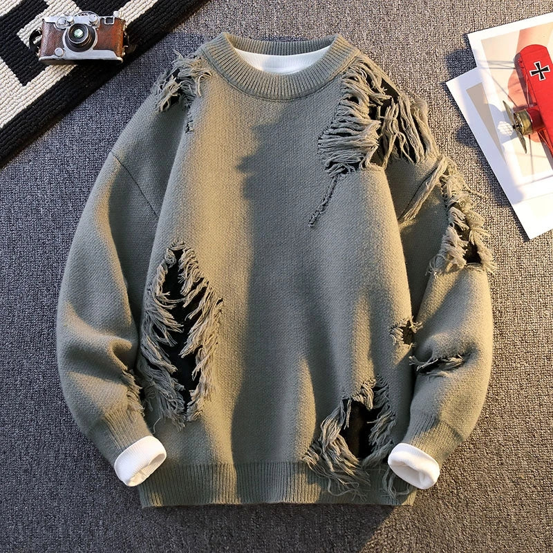 Beige relaxed-fit distressed knit sweater with frayed textured accents for everyday layering