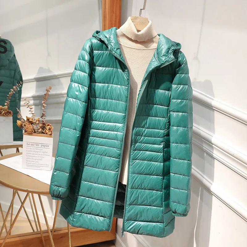 Women's long puffer jacket with hood, regular fit, elongated silhouette for cold-weather warmth