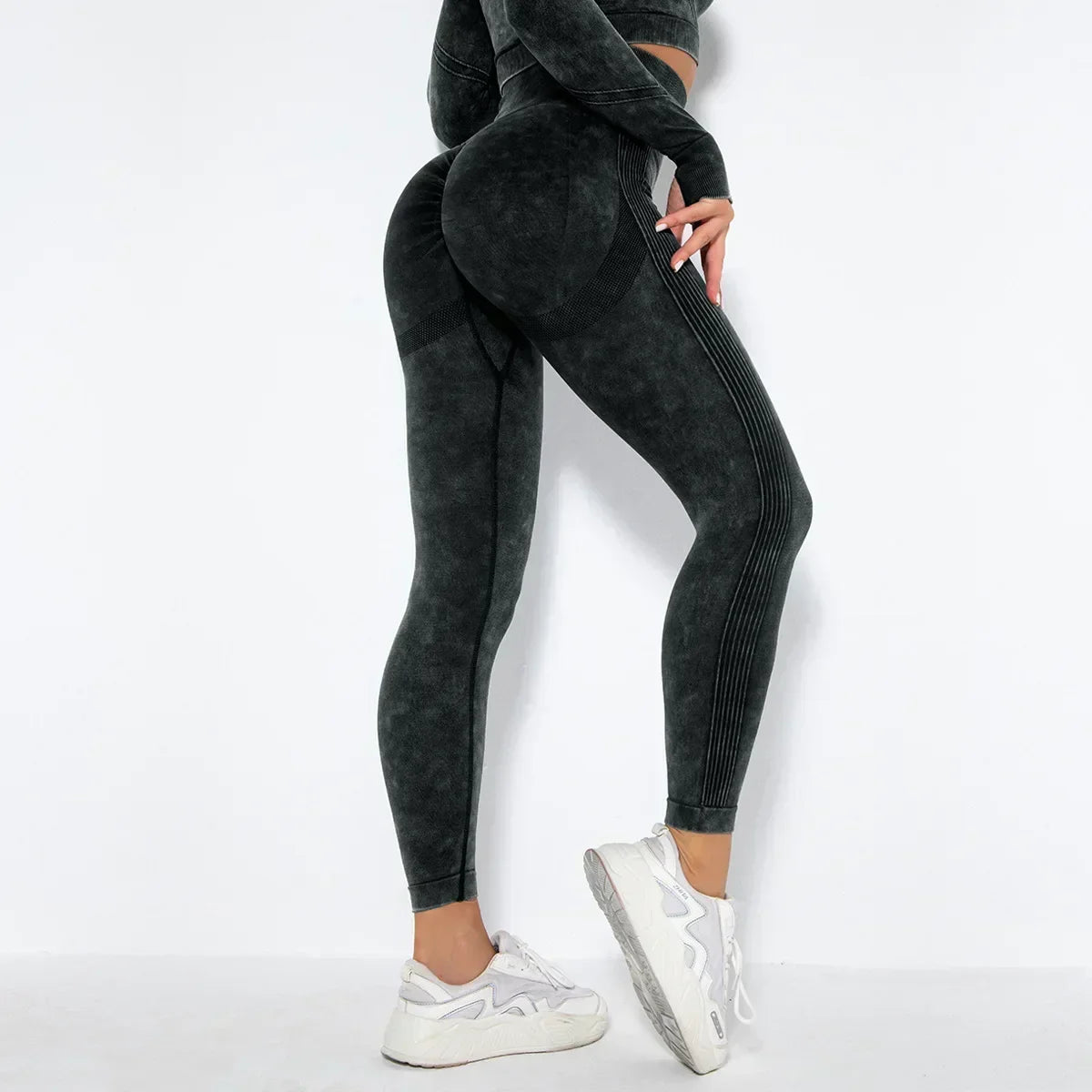 Black high-rise seamless compression leggings with sculpting contouring fit for active women