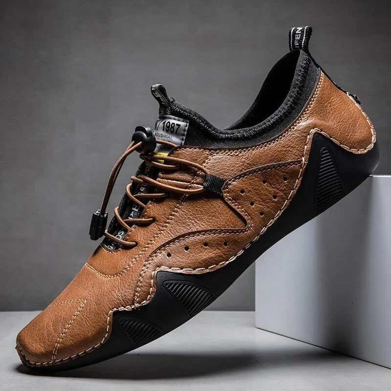 Men's tan perforated leather low-top driving shoes with bungee lace and orthopedic comfort sole