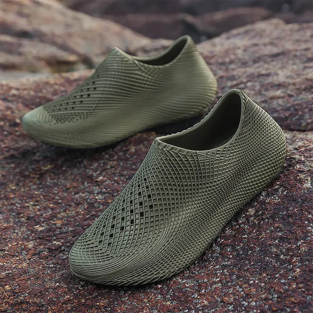 Lightweight white EVA slip-on runner slippers with kinetic-inspired contours for active athletes