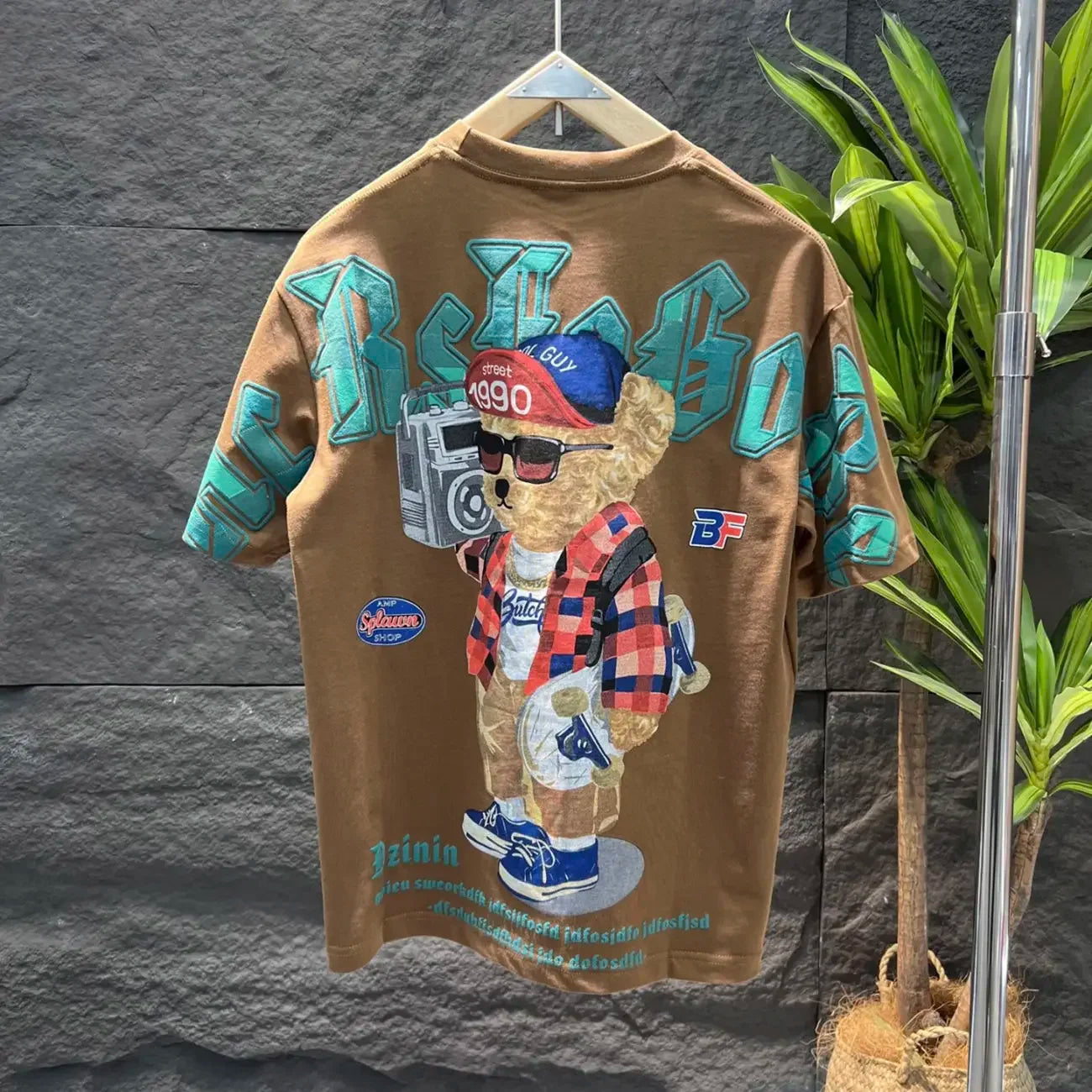 Oversized unisex vintage wash graphic tee in streetwear style with bold warped vandal print