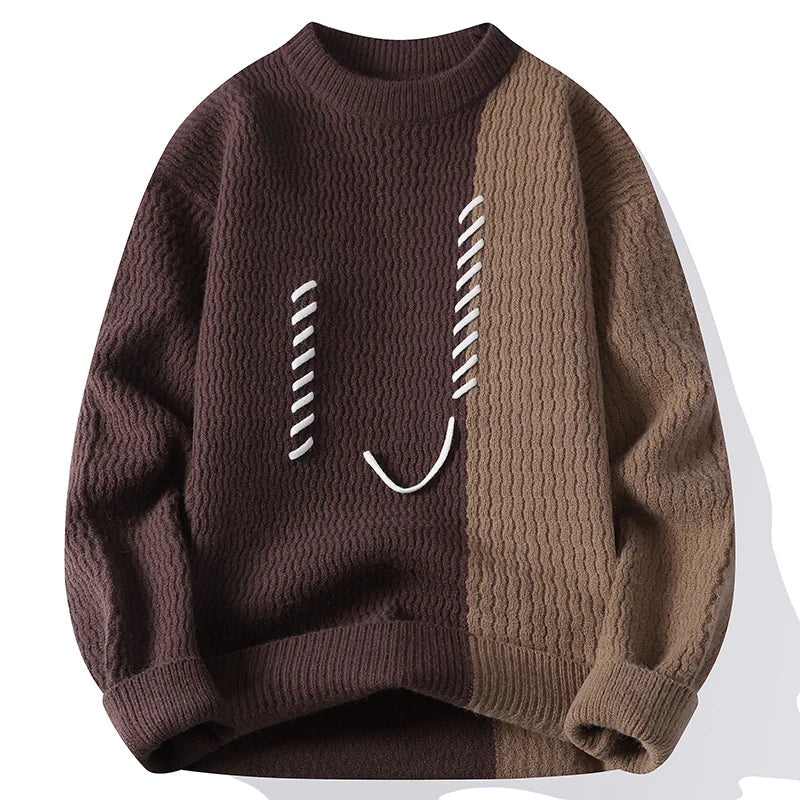 Cream and black two-tone textured knit sweater with stitched smiley motif, relaxed casual fit