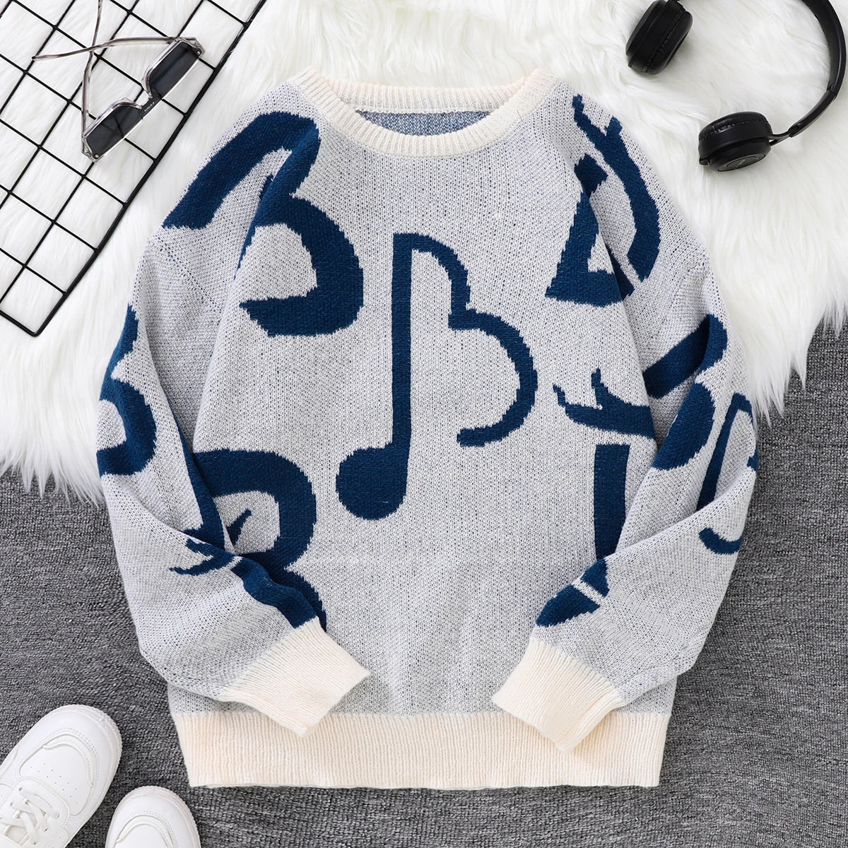 Black white music note pattern knit sweater oversized bold musical graphics cozy soft knit statement piece
