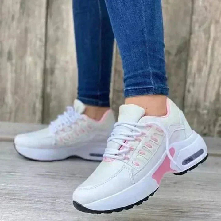 White ergonomic orthopedic running shoes with shock-absorbing soles and stable support design