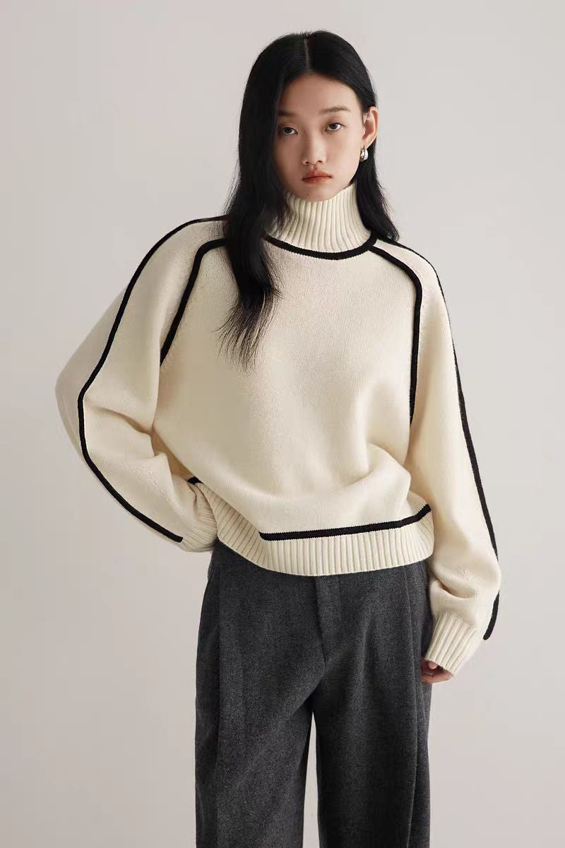 Ivory knitted turtleneck sweater with bold contrast seams, cozy soft knit, modern slim fit