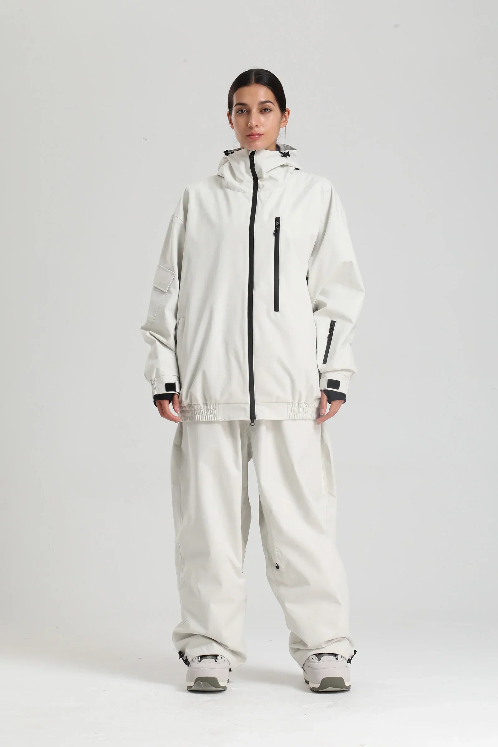 Unisex winter ski set with hood, sleek urban-mountain silhouette blending sportswear and streetwear style
