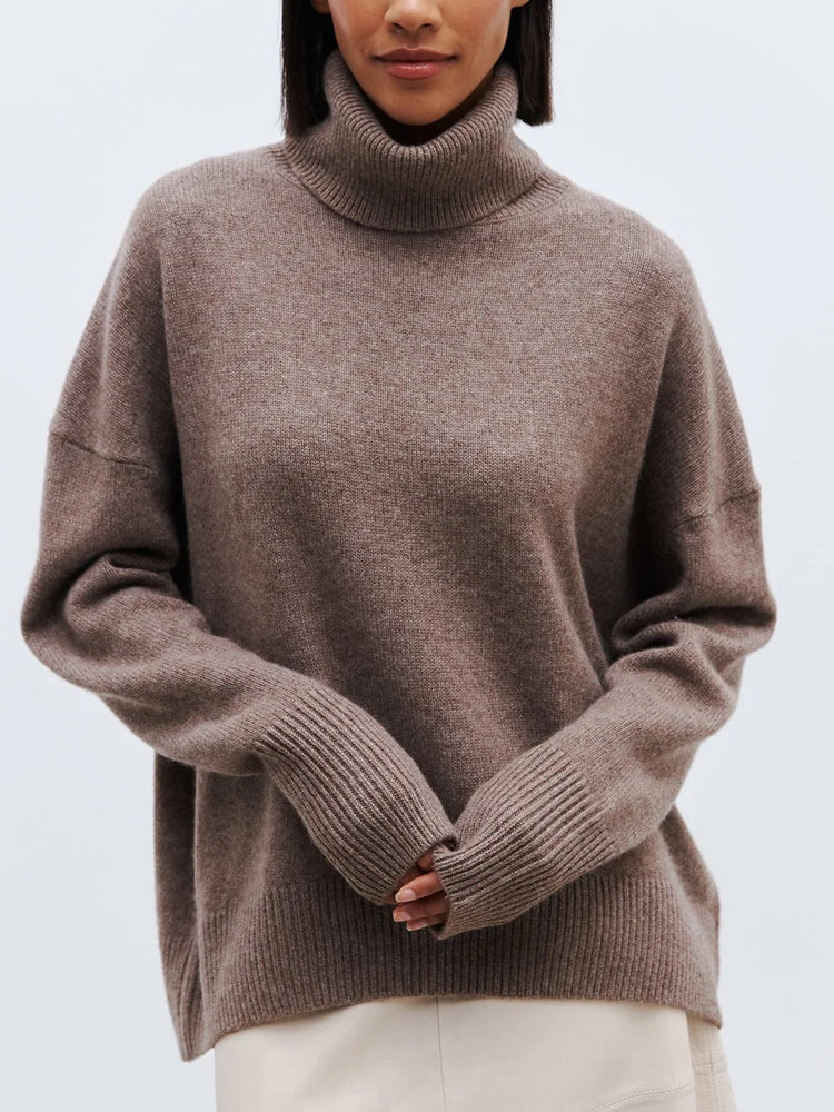 Women's oversized hip-length wool turtleneck sweater in a cozy relaxed fit with premium soft blend