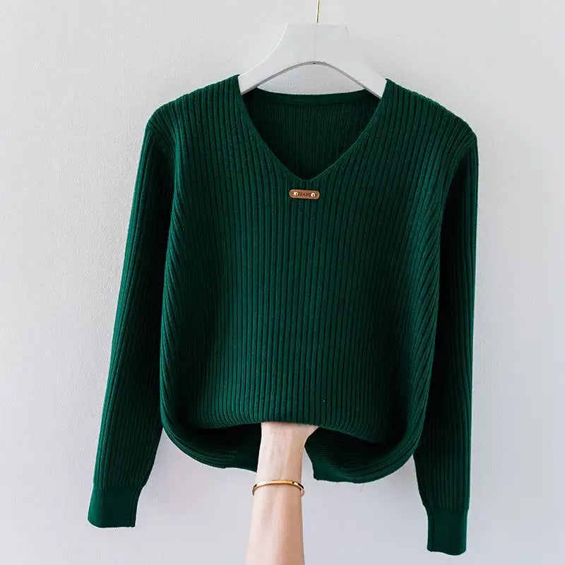 Women's ribbed knit V-neck top in lightweight stretch fabric with draped slim fit and minimalist collar charm
