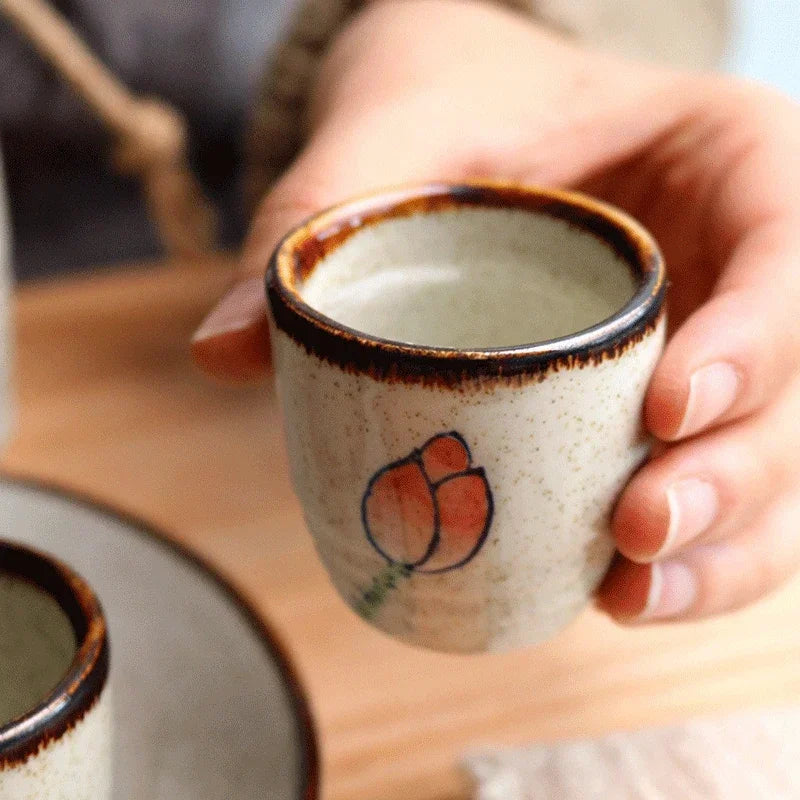 Handcrafted ceramic tumbler hand-glazed Hanami motifs textured finish for tea and sake lovers