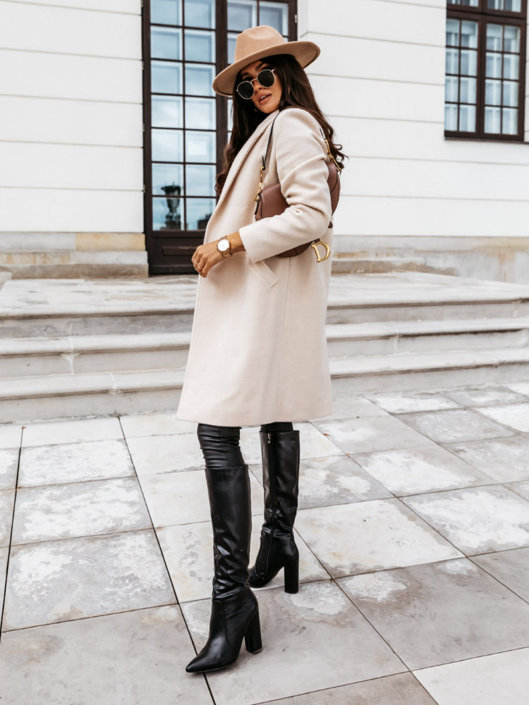 Women's double-breasted long coat structured tailored silhouette timeless elegant formal outerwear