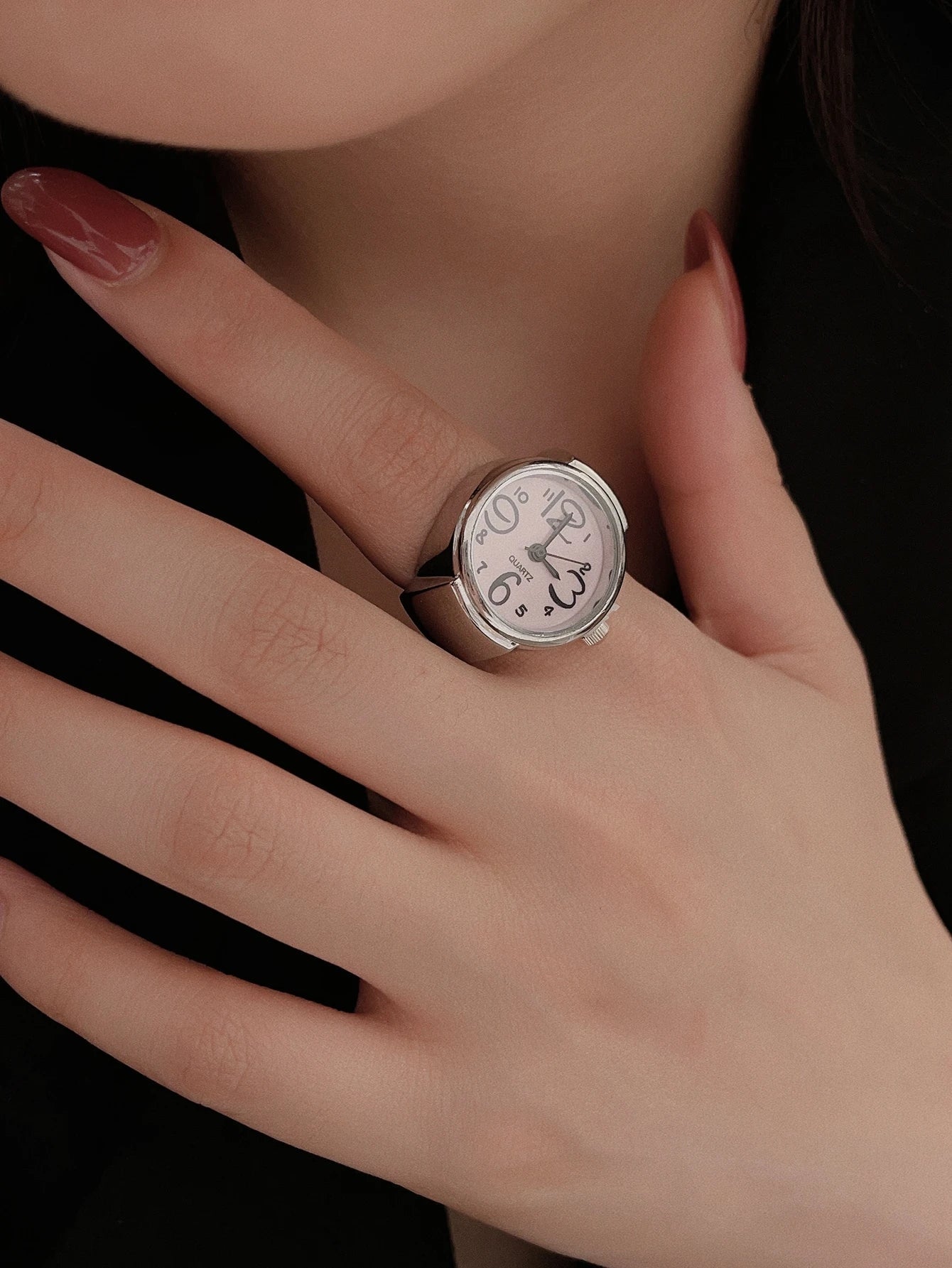Women's ring watch gold-tone statement accessory with functional dial, elegant finger-worn timepiece design