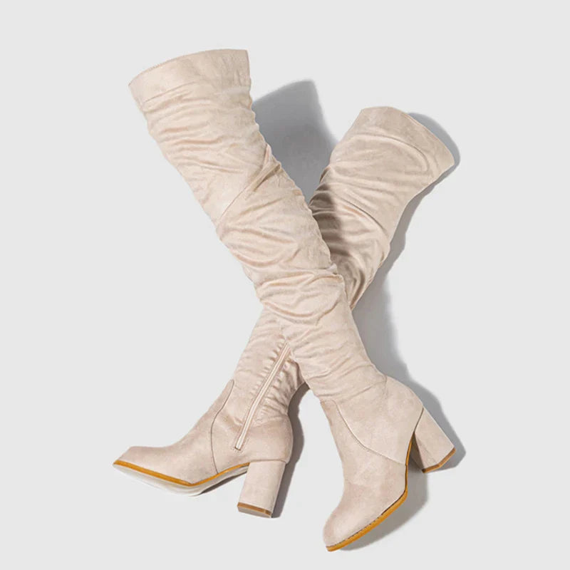 Black over-the-knee heeled boots women stiletto heel leg-lengthening silhouette night out glamour