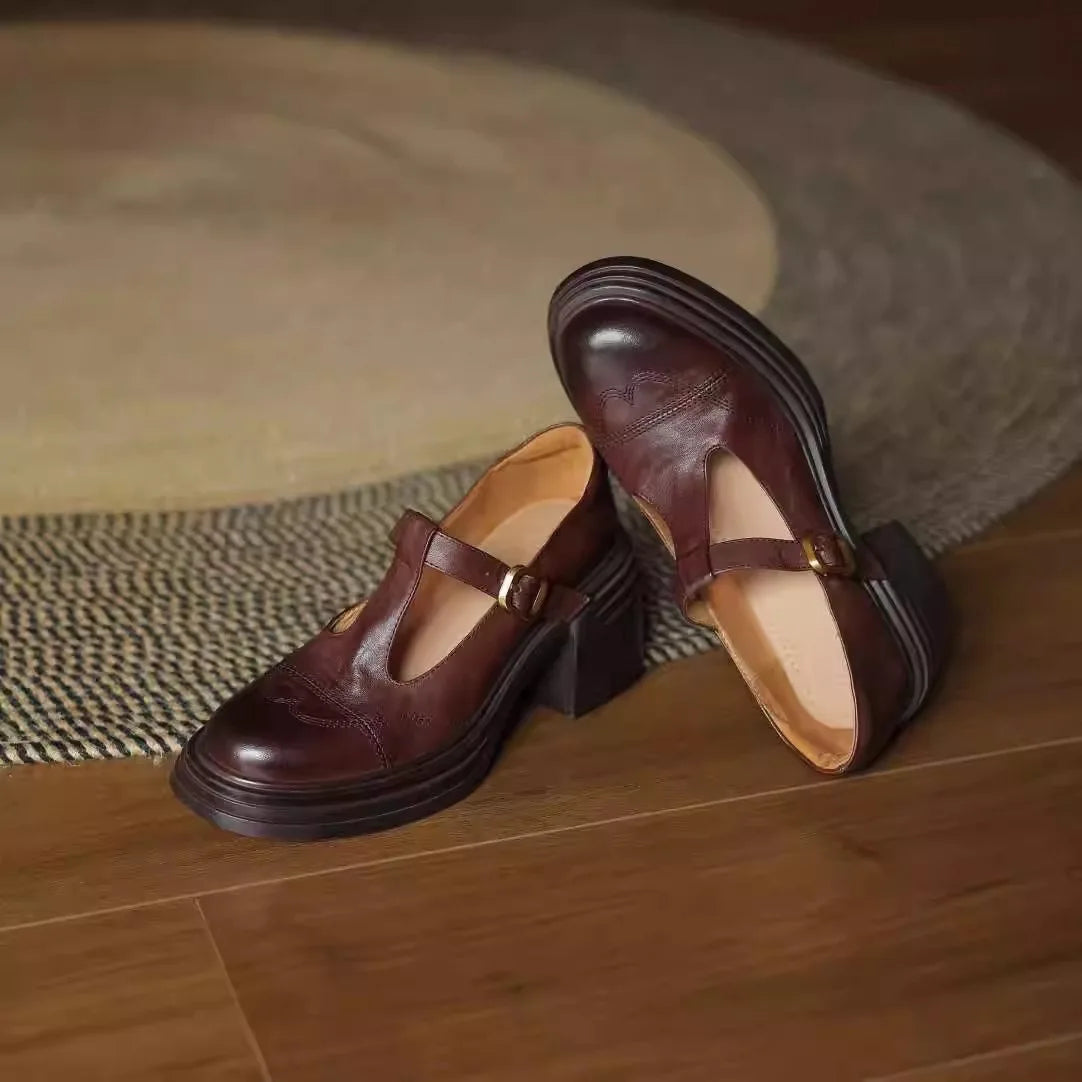 Women's black leather T-strap block heel shoes with vintage-inspired silhouette for elegant comfort