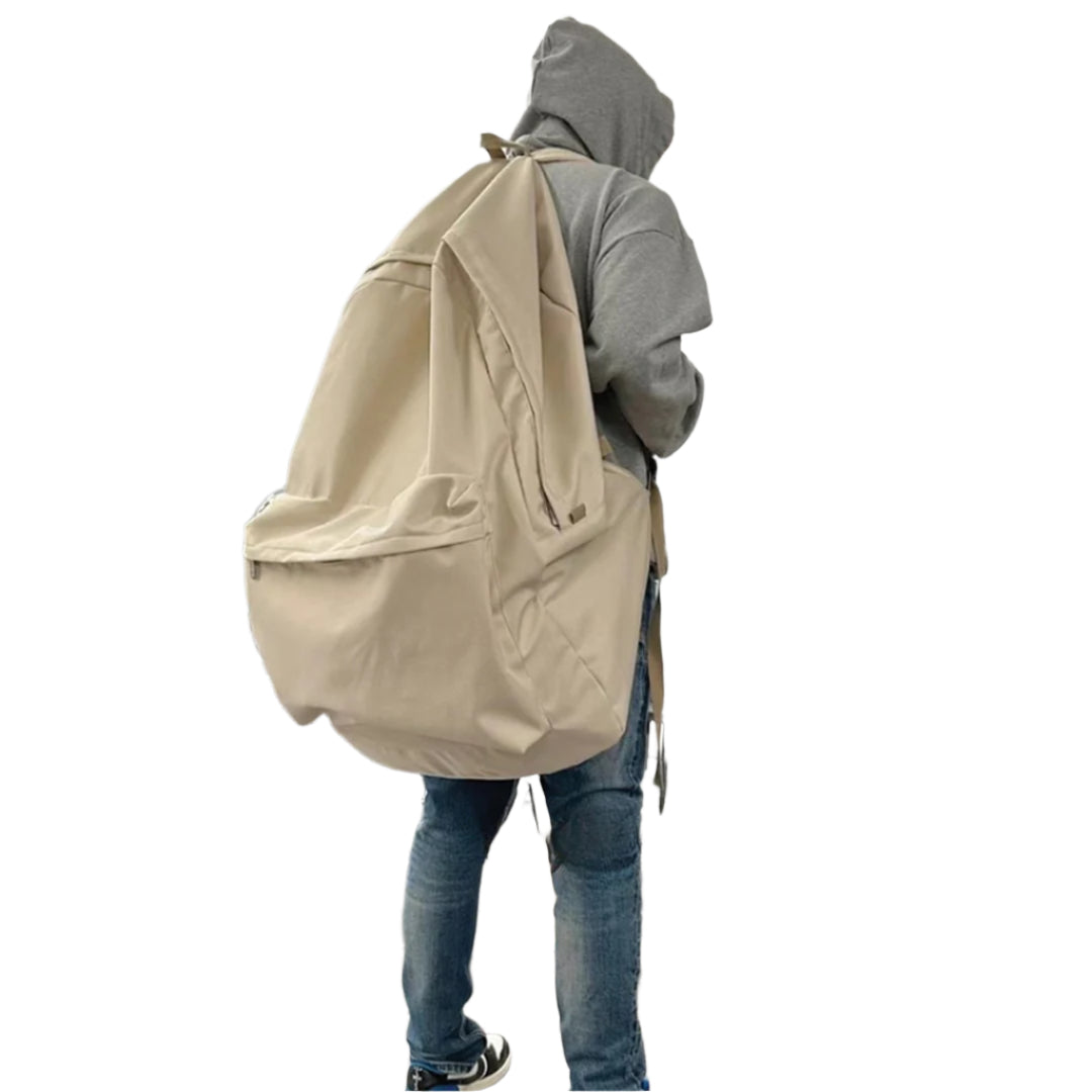 Oversized black nylon streetwear backpack with slouchy silhouette and bold utility design