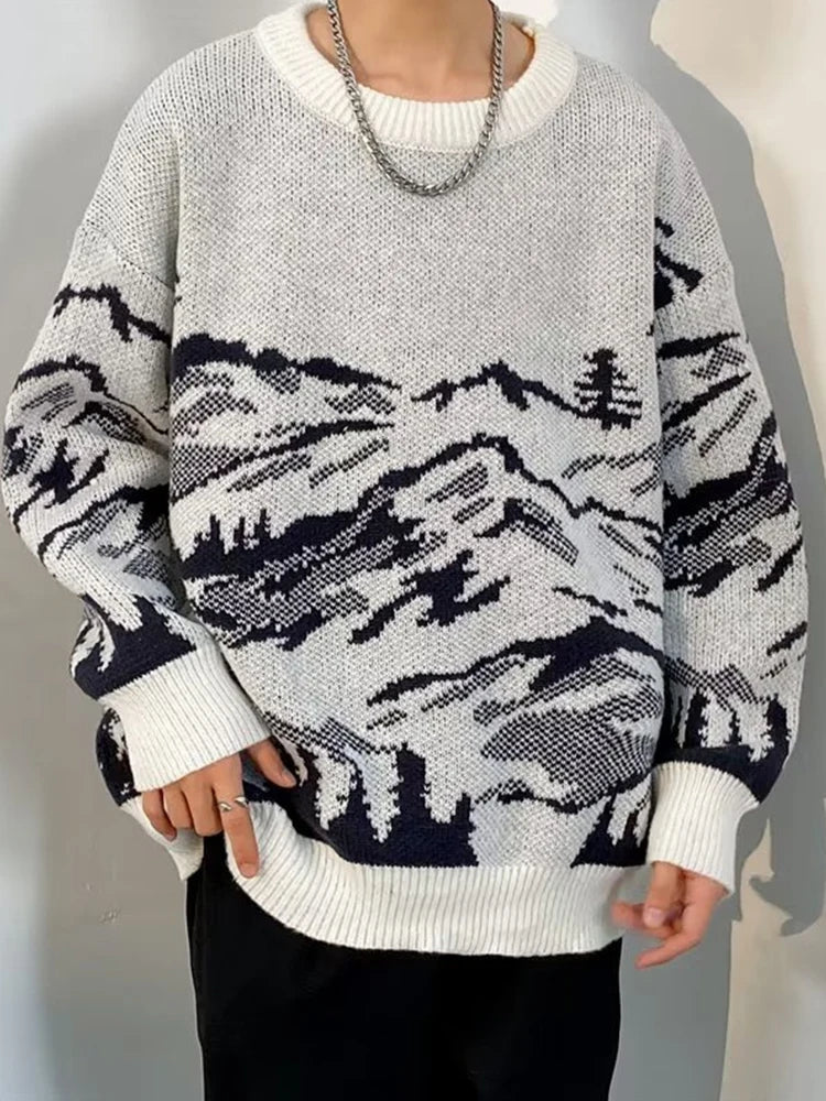 Oversized cream knit sweater with mountain landscape pattern, soft cozy outdoor-inspired cold-weather style