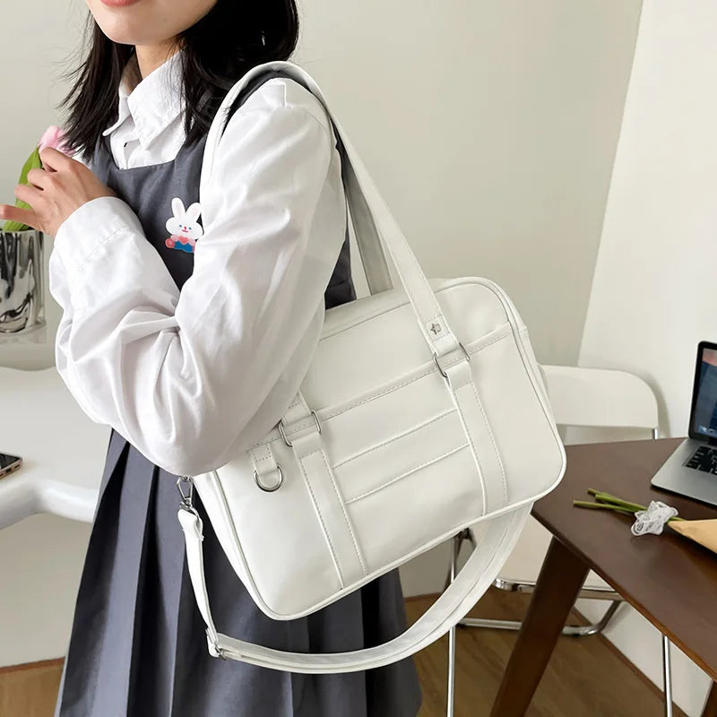 Women's vegan PU leather shoulder bag with star studs, adjustable strap, modern elegant style
