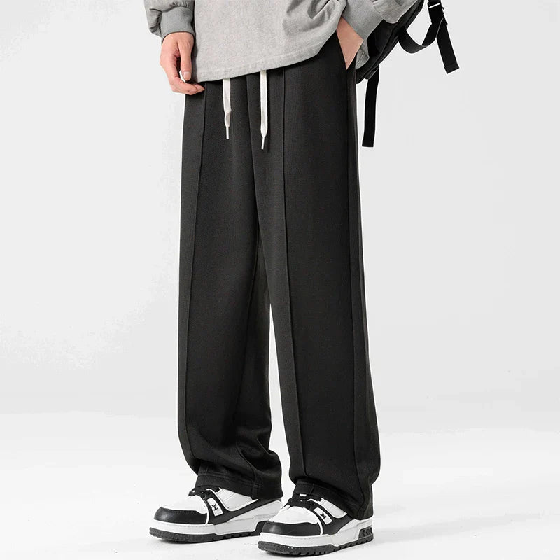 Gray relaxed straight-leg sweatpants with minimal stripe detail, midweight cotton blend for gym and lounge