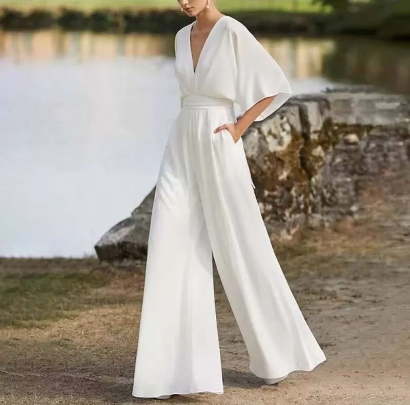 Women's solid color low waist long jumpsuit wide-leg side button closure sleek modern silhouette
