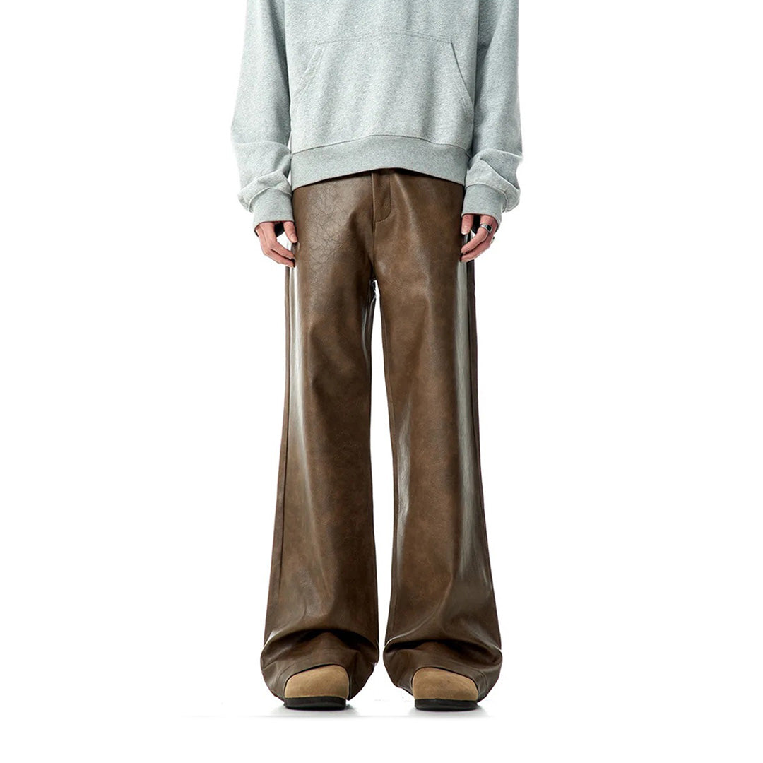 Black vegan leather bootcut midrise pants with American tailoring and cruelty-free durable finish