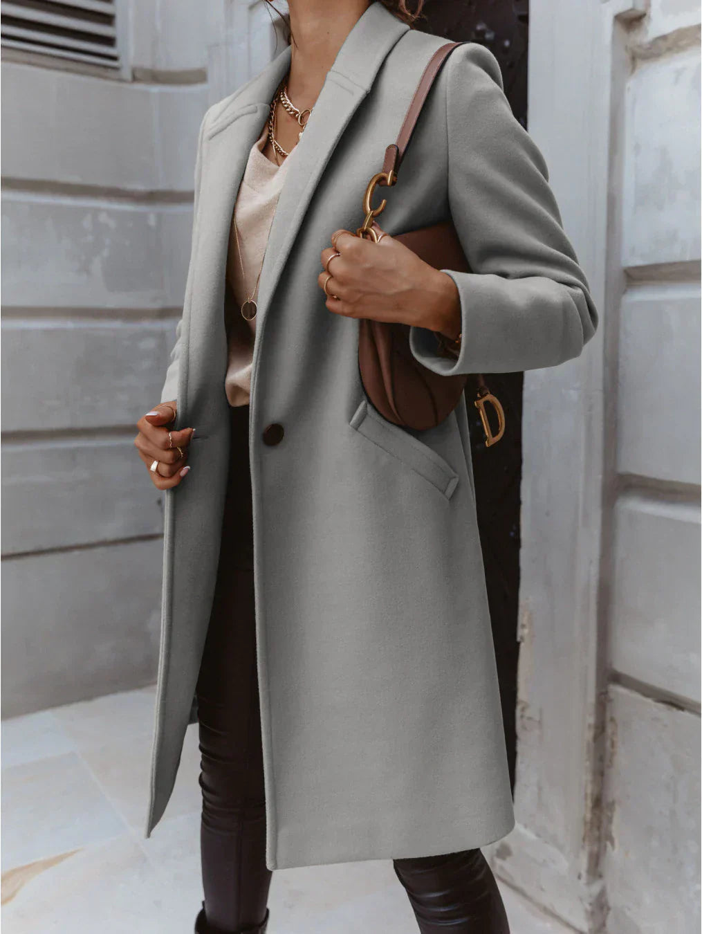Women's double-breasted long coat in classic tailored silhouette with structured front closure