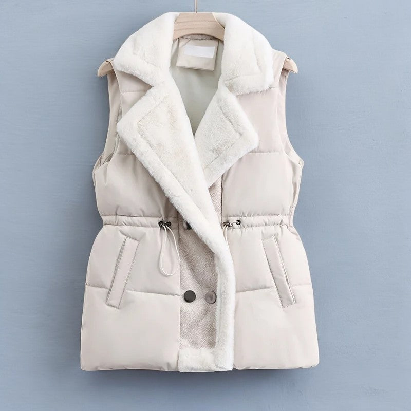 Women's black quilted puffer vest relaxed fit hip length with drawstring waist and collar