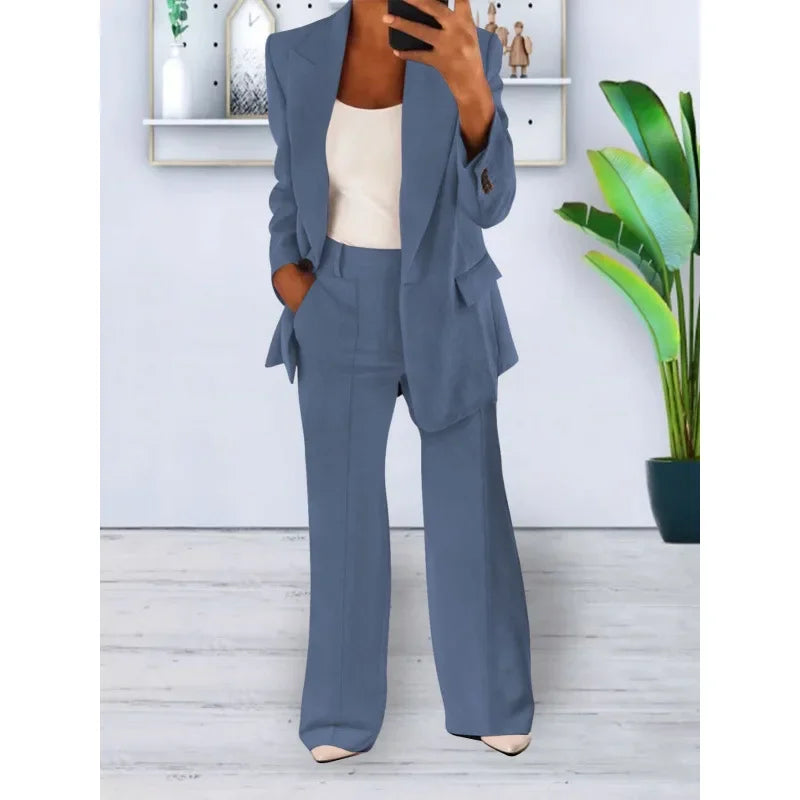 Women's black tailored long blazer suit set with straight-leg trousers and refined lapel