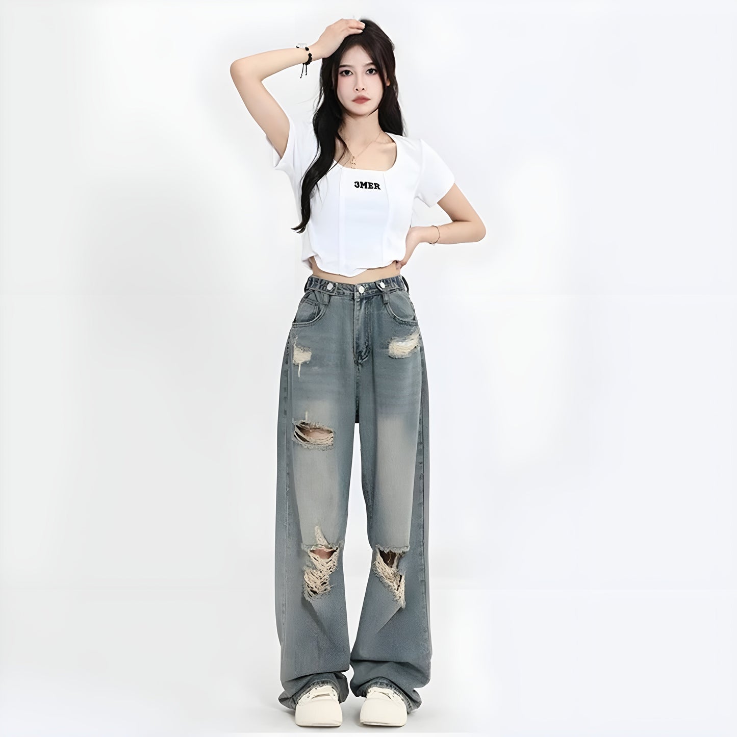 Women's blue distressed denim jeans high waist cinched fit oversized ripped vintage washed streetwear