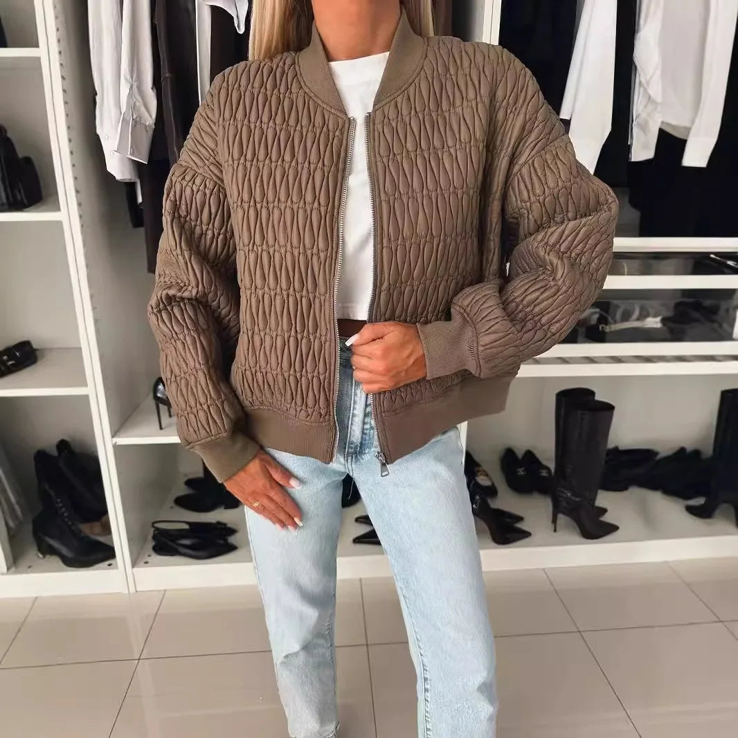 Women's black quilted bomber jacket with sporty-elegant cut and textured all-season design