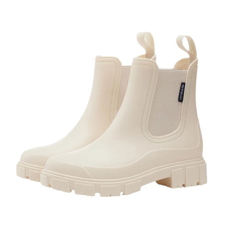Women's black waterproof Chelsea rain boots with elastic side panels for all-day everyday style