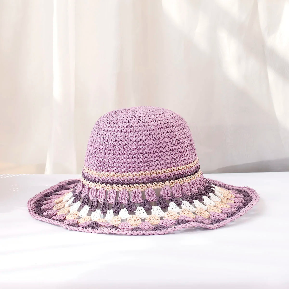 Women's boho wide-brim sun hat hand-crocheted with bold color block pattern for beach style