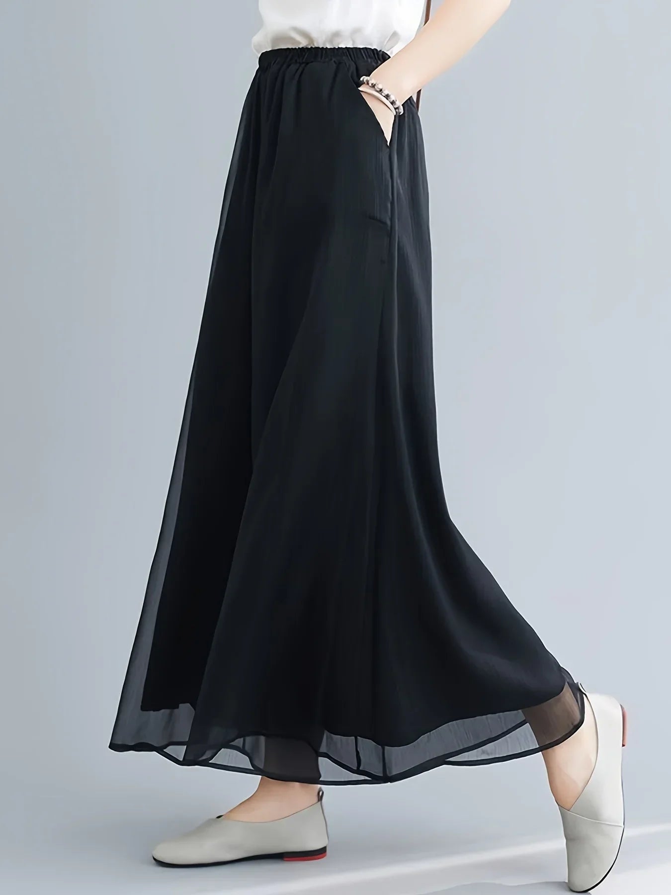 Women's sheer chiffon flare pants with double-layer mesh overlay and delicate sheer hem detail