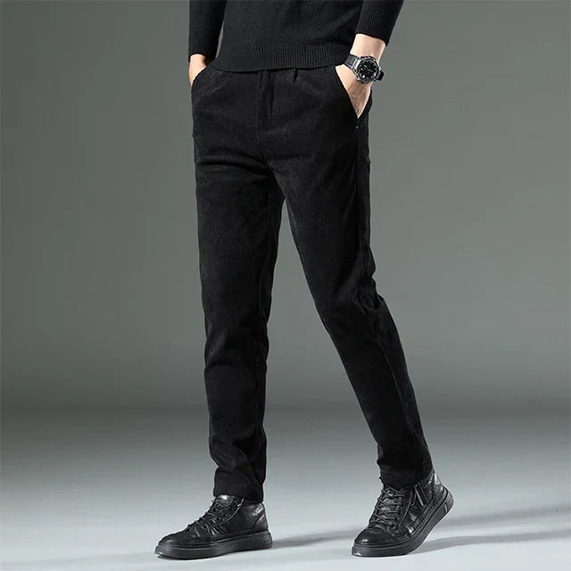 Men's relaxed pleated-front trousers with ribbed side pockets in neutral casual fall style