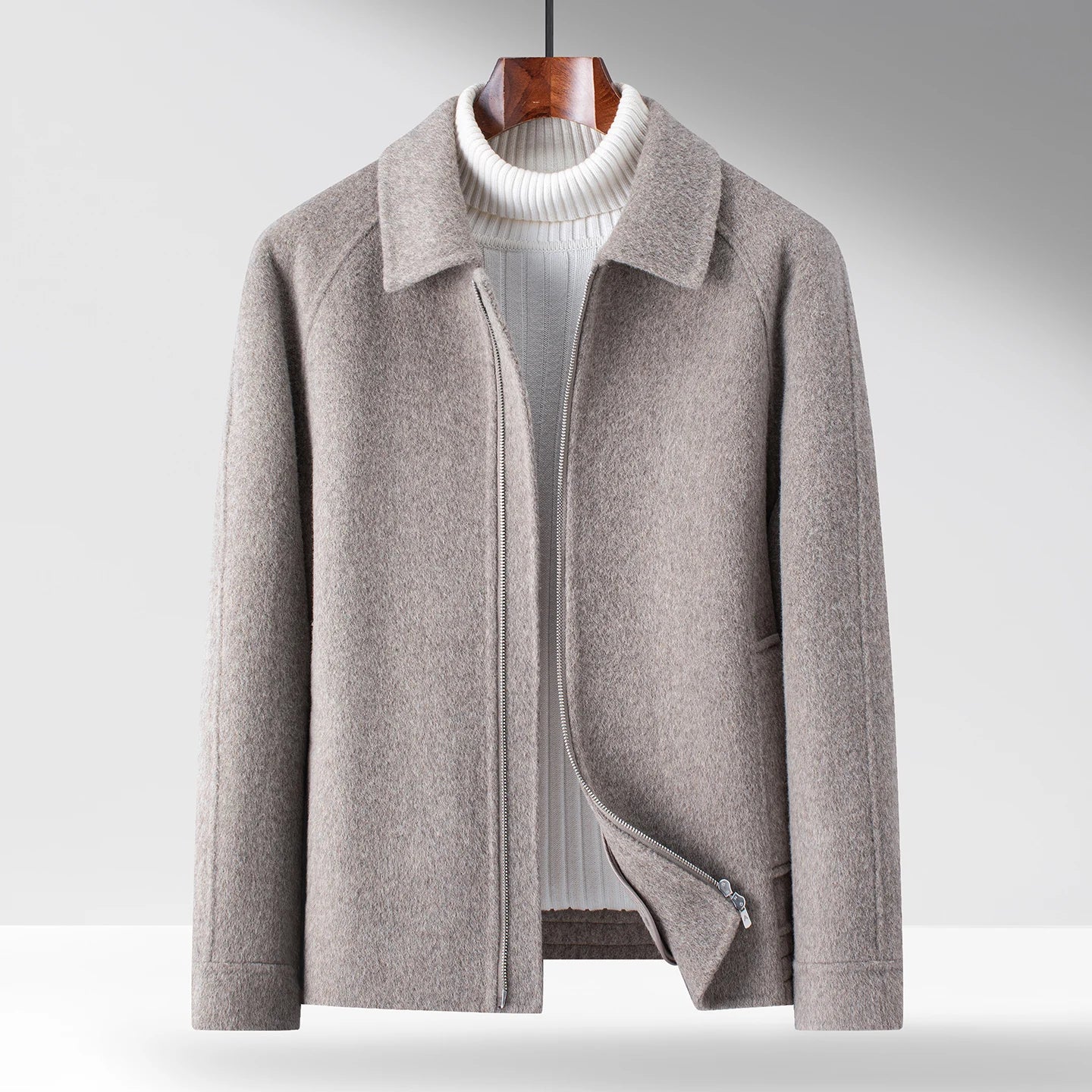 Black minimal zip-up winter jacket with polished collar and smooth interior for refined layering