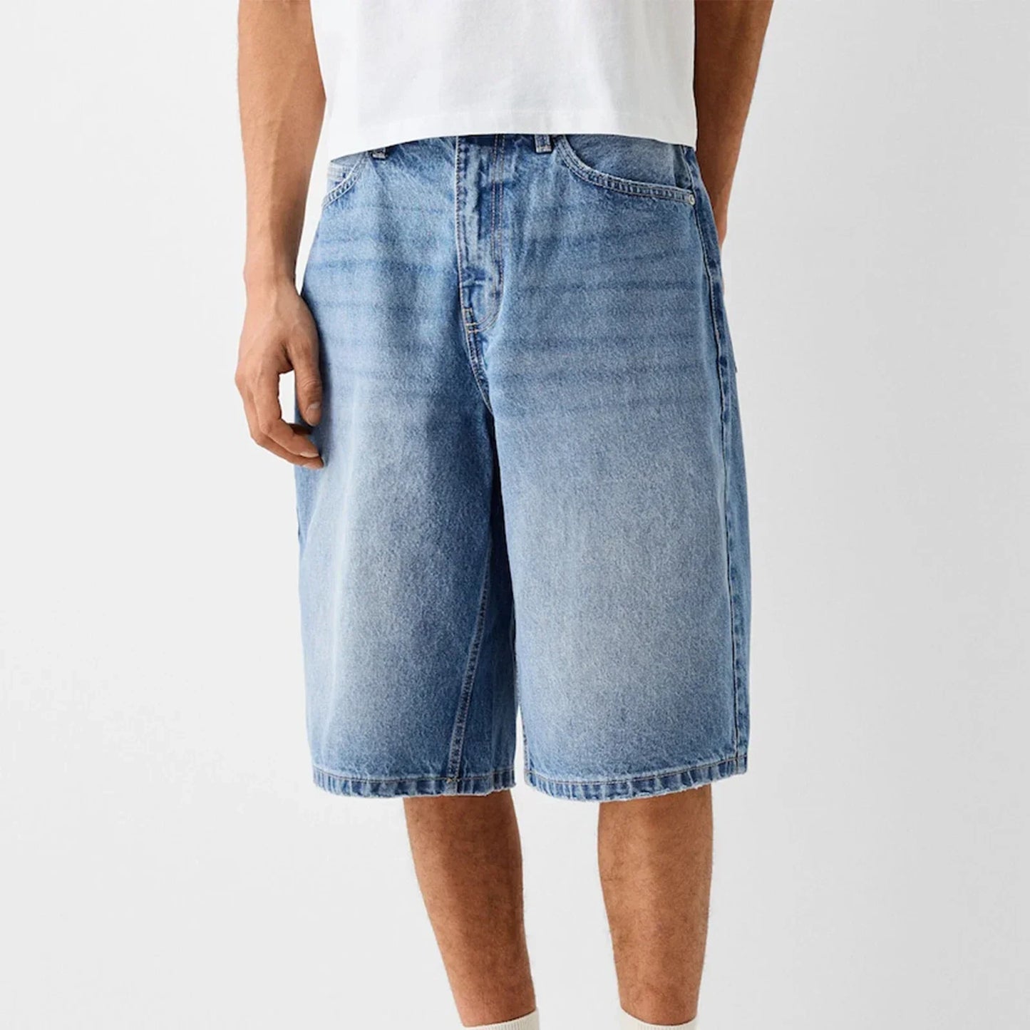 Men's wide-leg relaxed denim shorts in washed blue with reinforced stitching and classic five-pocket design