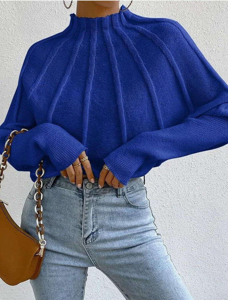 Women's ribbed knit sweater with sunburst pattern, mock neck, batwing sleeves, relaxed fit, soft polyester