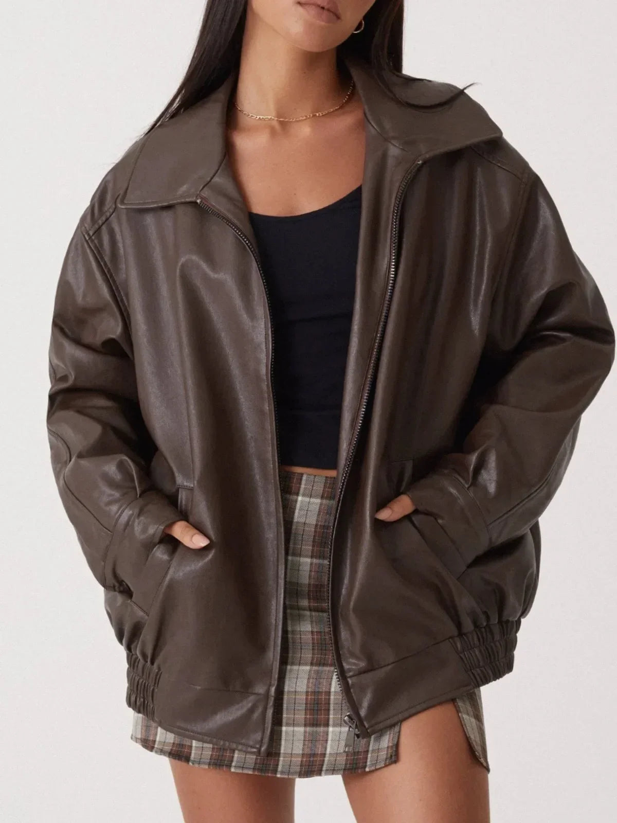 Black oversized glossy faux leather jacket relaxed silhouette bold street style vegan finish