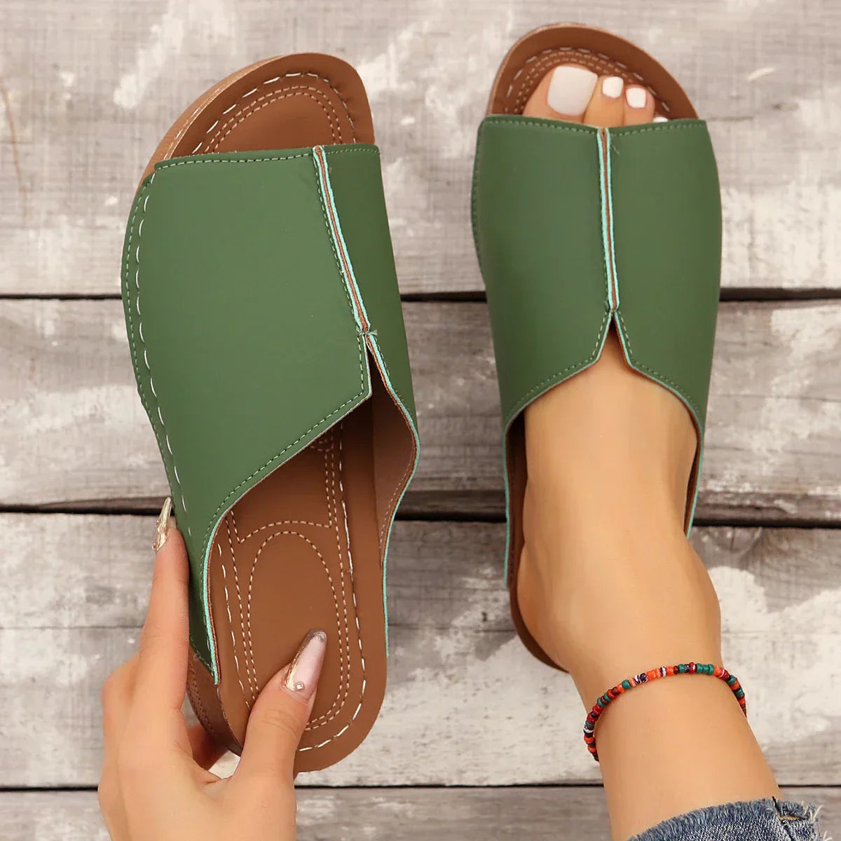 Women's red platform wedge slides with contrast stitching and anatomical sole for all-day comfort